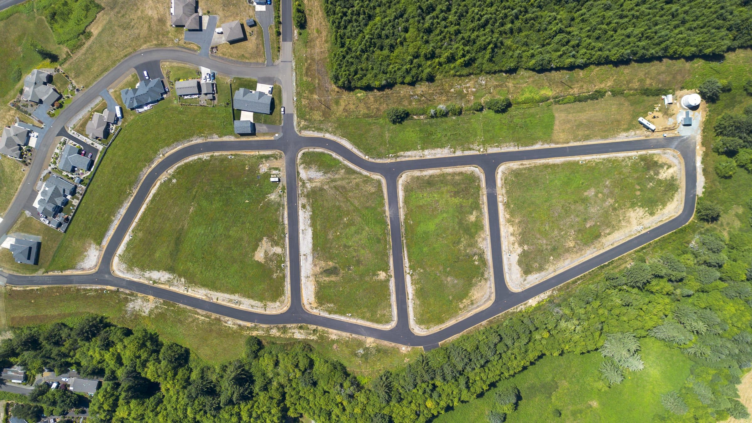 Aerial view of the Riverview Meadows subdivision above the Nehalem River, Oregon Coast Range beyond